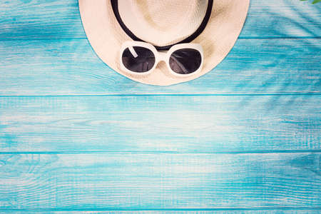 Top view of summer beach accessories on marine blue planksの写真素材