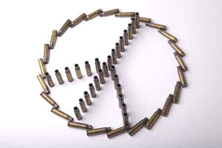 Peace sign assembled by cartridge-cases on isolated background 