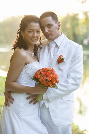 Bride and Groom smiling outdoorsの写真素材