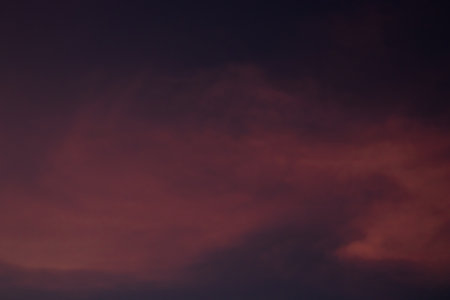 Dramatic sunset sky with dark clouds. Abstract natural background.