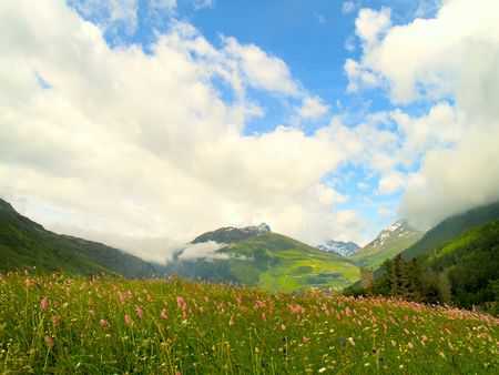 View of the Alps in Switzerland on a cloudy dayの写真素材