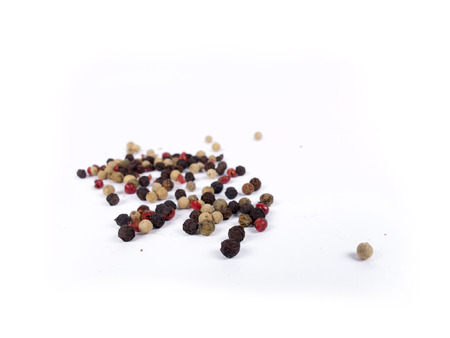 Pile of peppercorn isolated over whiteの写真素材