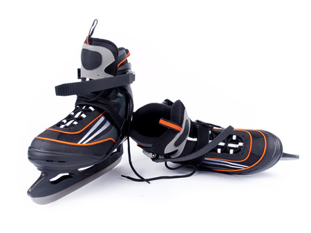 Pair of man ice hockey skates over a white backgroundの写真素材