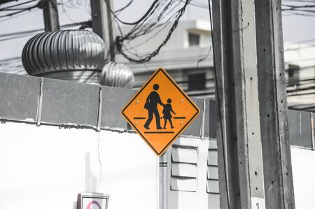 Yellow schoolzone sign board in Bangkok Thailandの写真素材