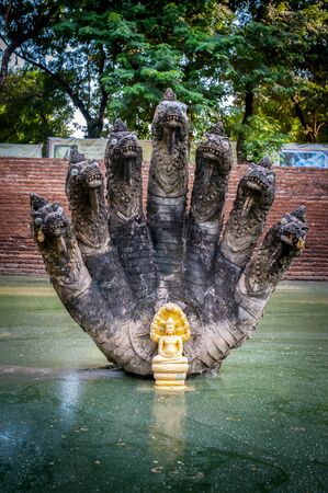 seven headed naga statue at pond of the Naga serpent (Sra Pappharanak) at Wat Phra That Bang Phuan ,Nong khai province Thailandの写真素材