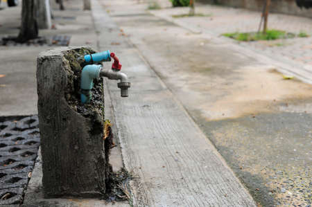 The pipe water supply is in concrete at the walk way of Asokaram temple in Samutprakarn province ,Thailandの写真素材