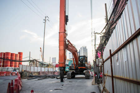 April 19,2020 Construction site of MRT underground train with pile driver Hitachi brand at Ramkhamhaeng road Bangkok Thailandのeditorial素材