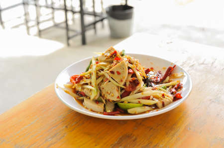 A dish of spicy papaya salad with vietnamese Pork Sausage in Bangkok Thailand