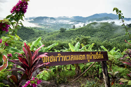 The signboard describe in thai word Checkpoint view of Phu Huay Isan mountain at Sangkhom district,...