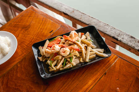 top view of Thai style stir-fried young coconut shoot  with oyster sauce and shrimpsの写真素材