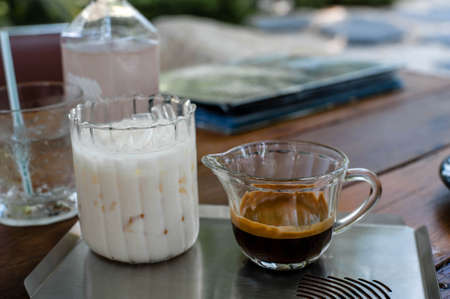 The signature Iced latte coffee in a cafe in Bangkok Thailandの写真素材