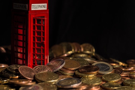 brexit concept - telephone kiosk and coins