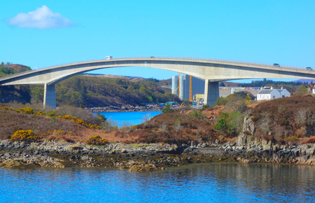 Skye Bridge - joining the Scottish mainland to the Isle of Skye in the Scottish Highlands. This is an alternative to travelling via a ferry to Skye .の写真素材