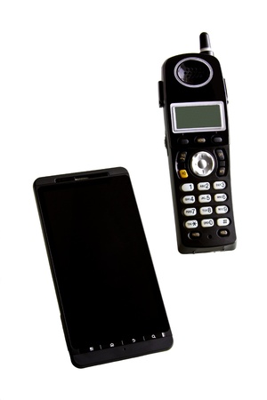 A smartphone with home and office portable phone on white backgroundの写真素材