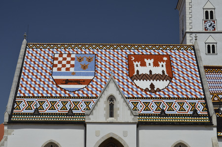 Characteristic colorful tiled roof of the Cathedral of San Marcoの写真素材