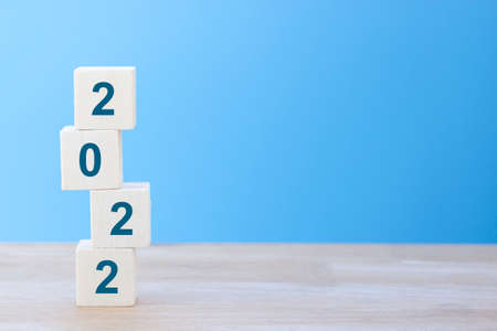 Wooden cube with New Year 2022 number, start up for New Year 2022, Happy New Year changing year,...