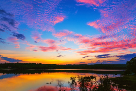 Sunset / sunrise with clouds, light rays and other atmospheric effect, selective White balance.の写真素材
