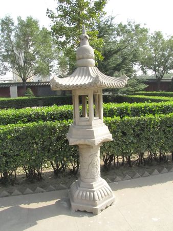 Lamp front of bushesの写真素材