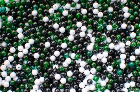 Background black white and emerald color beadsの写真素材