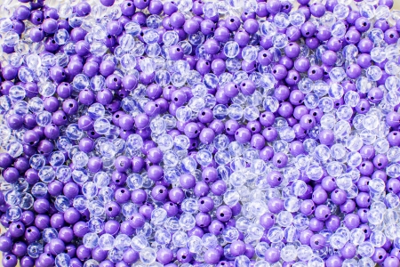 Background purple and Transparent white beadsの写真素材