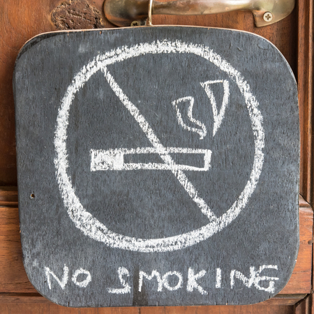 Plywood Signs prohibiting smoking chalk white.の写真素材