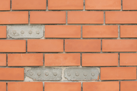 Wall terracotta tiles red spacing groove.の写真素材