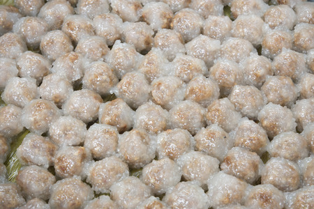 Thailand dessert sago pork on banana leaf steamed until cooked.の写真素材