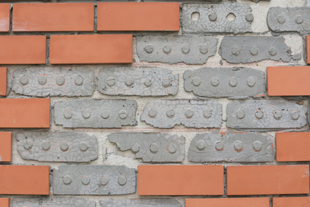 Wall terracotta tiles red spacing groove.の写真素材