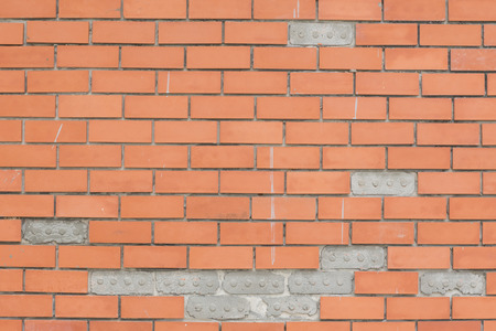 Wall terracotta tiles red spacing groove.の写真素材