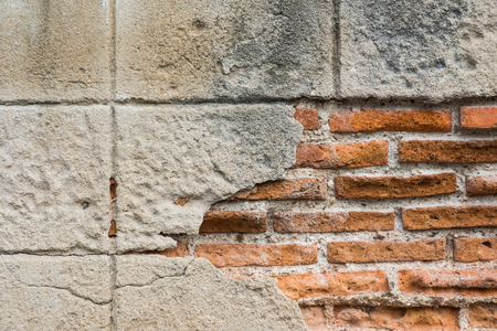 Wall brick and plaster Peeling and crackingの写真素材