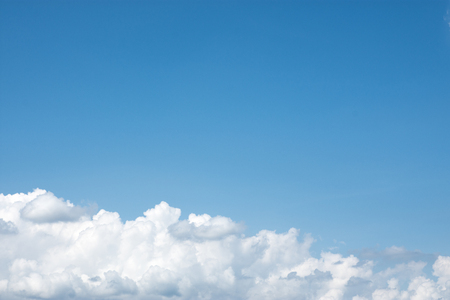 Bright blue sky with white clouds.の写真素材