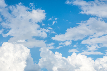 Bright blue sky with white clouds.の写真素材