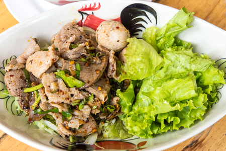 Spicy Pork with green vegetables in a bowl.の写真素材