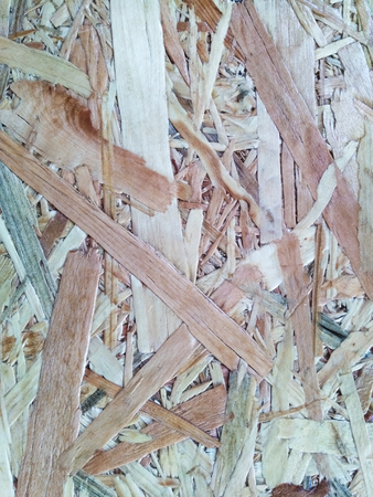 Coarse brown plywood surface paint coating.の写真素材