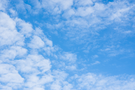 Bright blue sky with white clouds.の写真素材