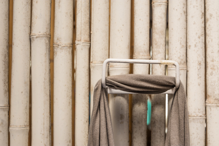 Hand towel hanging on the walls of bamboo.の写真素材