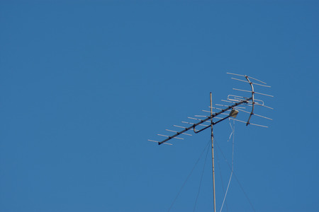 Blue sky with television aerialsの写真素材