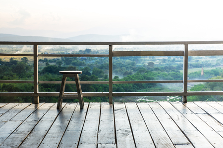 Ancient wooden chair on the balcony.の写真素材