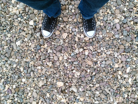 A man who stands for something on the stone surface.の写真素材