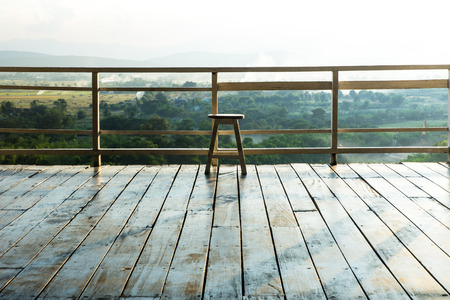 Ancient wooden chair on the balcony.の写真素材