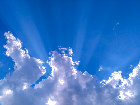 White clouds with blue sky and sunlightの写真素材