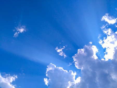 White clouds with blue sky and sunlightの写真素材
