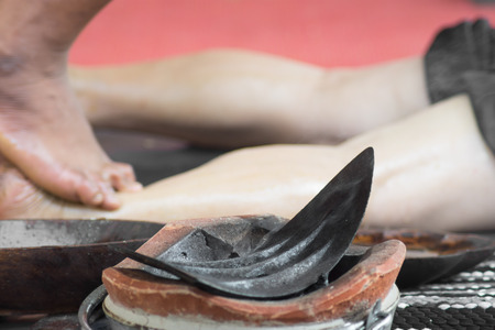 Thai massage using herbal feet touched with hot iron.の写真素材