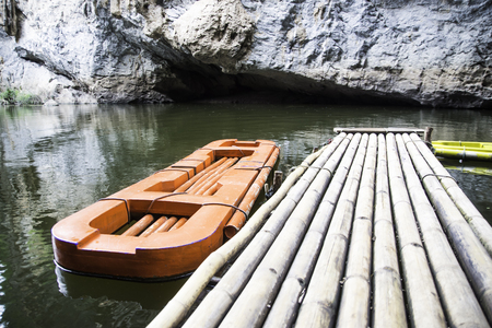 Tourist boats along the river and high mountains in Lampang province Thailandの写真素材