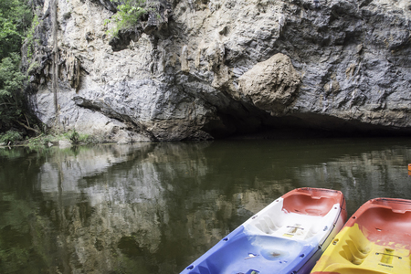 Tourist boats along the river and high mountains in Lampang province Thailandの写真素材