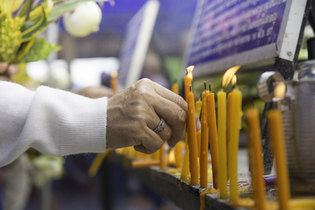 Kindle candles to worship the Buddha. In the northern temple of Thailand.の写真素材