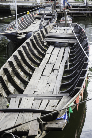 Two old wooden boats were used as river bridges.の写真素材