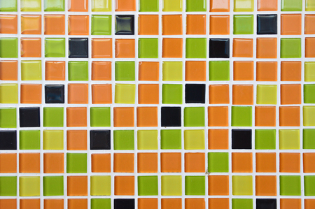 tile wall background. orange yellow greenの写真素材