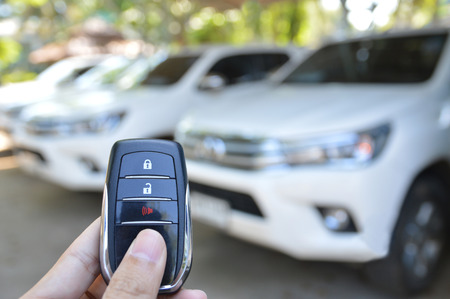 People use the remote control to open or lock the car. Transportation concept.の写真素材
