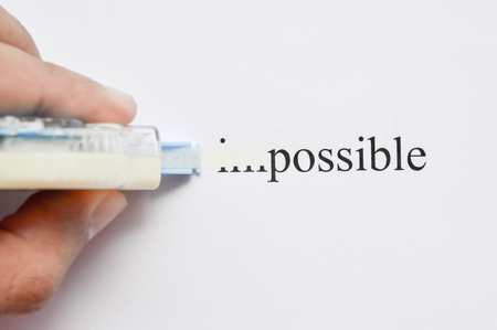Possible Concept. Changing The Word Impossible to Possible. Deleting word im to Possible. Focus at text or words.の写真素材